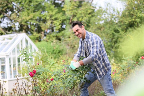 Worker wearing PPE during a Southfields landscaping task